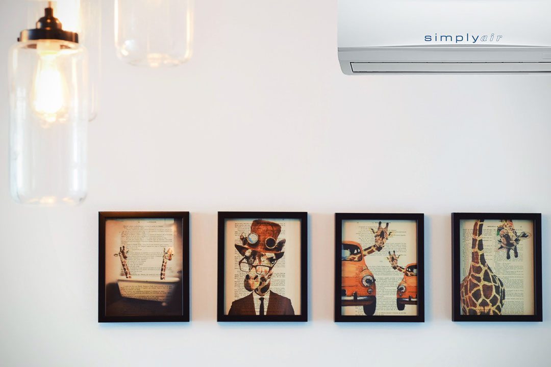 Simply Air Airconditioning system mounted on wall full of photo-frames