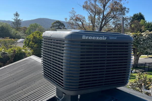 Breezair evaporative cooling unit on the roof of a house