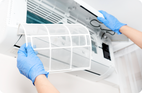 Hands servicing an air-conditioning unit