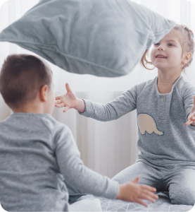 Children enjoying gas ducted heating at home