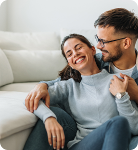 Couple enjoying gas ducted heating at home