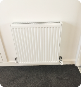 Hydronic heater on wall