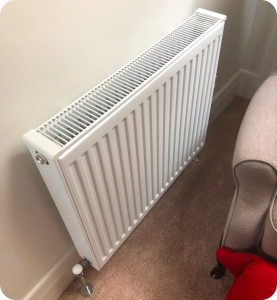 Hydronic heater on wall