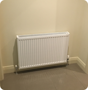 Hydronic heater on wall