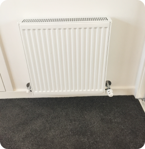 Hydronic heater on wall