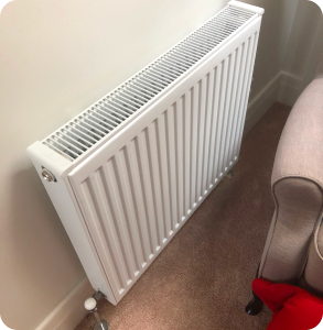 Hydronic heater on wall