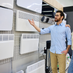 Couple looking at possible wall heaters for their home
